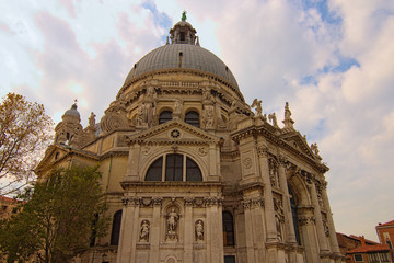 Wide angle landscape view of famous Santa Maria della Salute Basilica (English: Saint Mary of Health). Built in the palladian style as an offering for protection from the plague. Venice, Italy.
