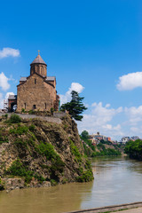 Fototapeta na wymiar Metekhi temple above Mtkvari (Kura) river, Tbilisi, Georgia