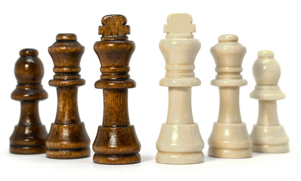 conceptual photo of chess pieces on a white background