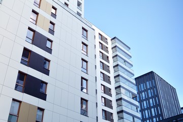 Fragment of modern residential apartment with flat buildings exterior. Detail of new luxury house and home complex. 