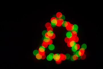Christmas garland with colorful lights in the shape of a christmas tree.