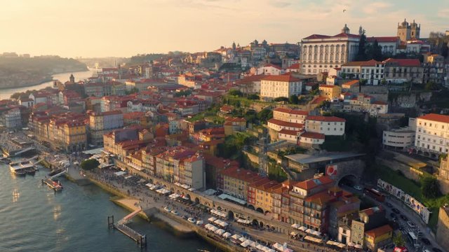Porto, Portugal. Aerial view of the old city with promenade of the Douro river at sunset