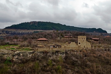 Fototapeta na wymiar Autumn panorama of a ruins of Trapezitsa, medieval stronghold located on a hill with the same name in Veliko Tarnovo, Bulgaria, Europe 