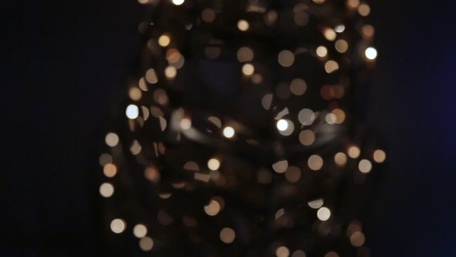 a group of blurry lights move between the shadows