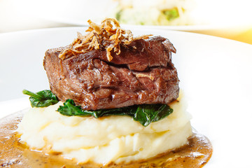 juicy steak beef meat and mashed potatoes