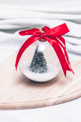 Christmas decorative ball with the Christmas tree and snow in it
