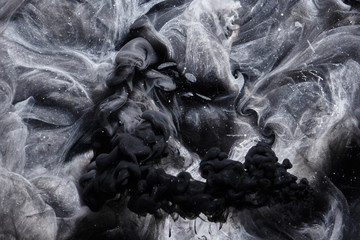 Abstract black and white swirling smoke background. Cumulus thunderclouds, mysterious and...