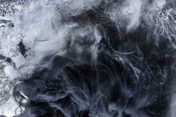 Abstract black and white swirling smoke background. Cumulus thunderclouds, mysterious and...