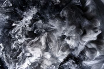 Abstract black and white swirling smoke background. Cumulus thunderclouds, mysterious and...