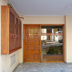 Fototapeta na wymiar contemporary house entrance solid wood and glass door, Athens Greece