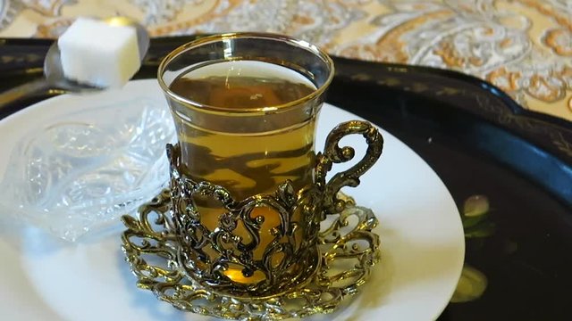 preparation of green tea in a glass to be served