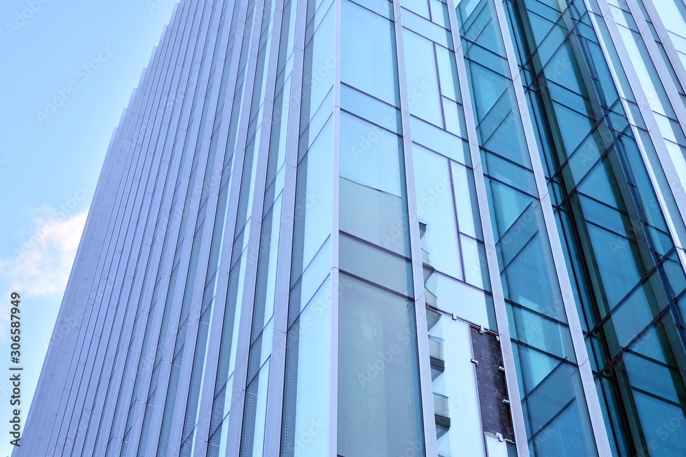 Wall mural abstract texture of blue glass modern building skyscrapers. business background.