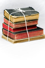 stack of old books tied with a rope