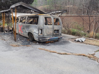 Van burnt up in raging wildfire with search marking on the side