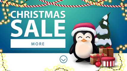 Christmas sale, blue discount banner with garlands and penguin in Santa Claus hat with presents near the blue wall