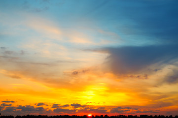 Fototapeta na wymiar Sky and bright sunset over the horizon.