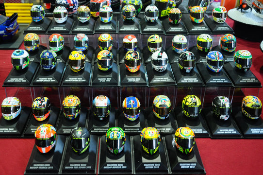 SERDANG, MALAYSIA -JULY 30, 2016: Miniature model of MotoGP champion Valentino Rossi helmets arranged on the table.