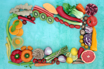 Health food for a healthy life concept with health food high in antioxidants, anthocyanins, vitamins, minerals, protein, omega 3 & fibre. Abstract background border on turquoise. Flat lay. 