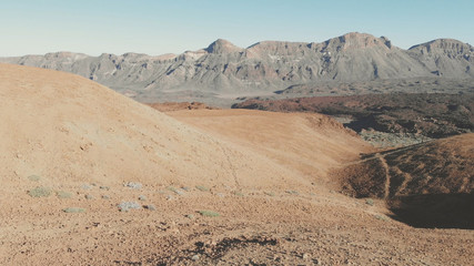 View from the drone - volcanic sand hills, desert and high mountains in the Teide National Park, Tenerife, Canary Islands, Spain