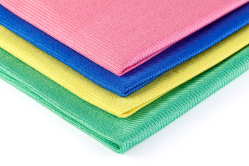 Multicolored Microfiber cleaning cloth Isolated on white background closeup . Top view.