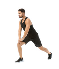 Obraz premium Sporty young man training against white background