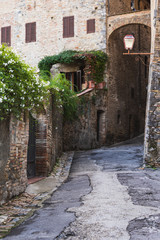 Old narrow european street with brick houses