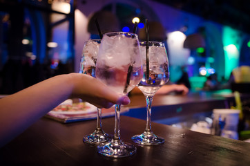 Glass of Aperol Spritz cocktail on bar counter