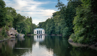 Fototapeta na wymiar Beuatiful view of pond 'Ionian sea' and Flora Pavilion in park Sofiyivka , Uman, Ukraine