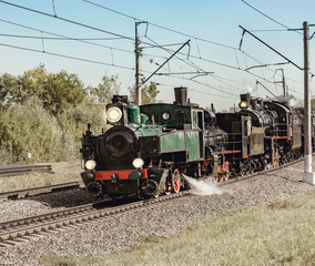 Fototapeta na wymiar Steam train moves at day time. Moscow. Russia.