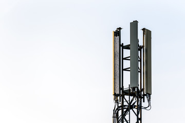 mobile network operator mast over cloudy sky in uk