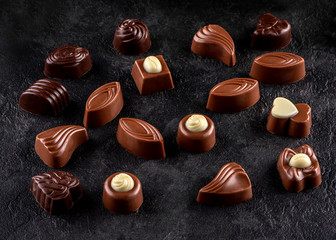 chocolates praline variety on dark background