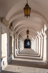 Old renaissance or mannerist arcades of tenement house in Zamosc, sunny day in Zamosc, touristic destinations in Poland, example of Lublin renaissance