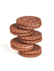 brown chocolate round cookies in a stack isolated on white background