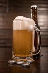 Pint Of Beer Overflowing And  Bottle