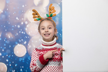 Smiling girl in the winter look. Christmas concept.