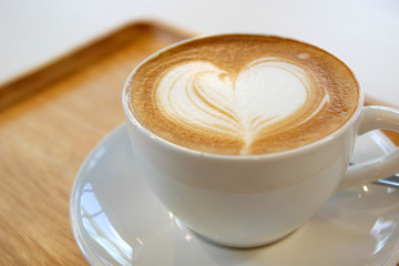cup of hot latte art coffee