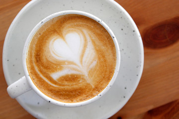 cup of hot latte art coffee