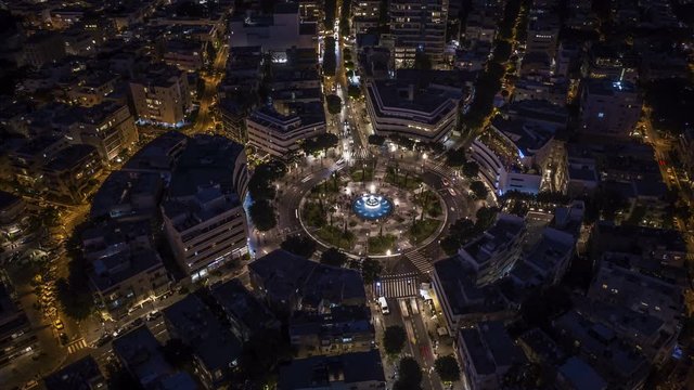 Big roundabout - Aerial hyperlapse - Dizengoff square in tel Aviv, Israel, at night, 4k drone view