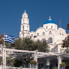 Fototapeta na wymiar Santorini White Church Cross Dome