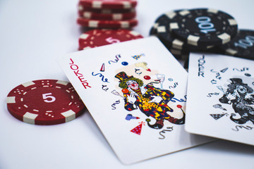 poker chips and cards on white background