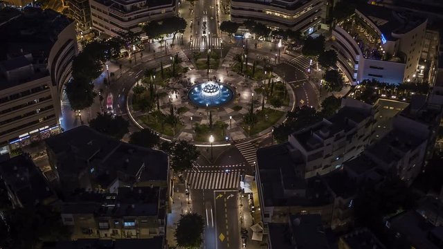 Big roundabout - Aerial hyperlapse - Dizengoff square in tel Aviv, Israel, at night, 4k drone view