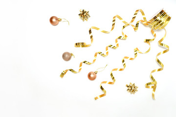 New year composition. Stylish decor concept, christmas tree baubles toys, golden ribbons, bow isolated on white backdrop. Flat lay, copy space. Background for postcard, for shopping....
