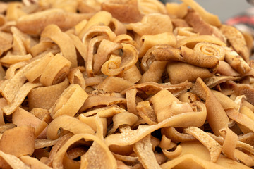 Smoked pork rind - soric afumat, Romanian traditional food at winter Christmas market