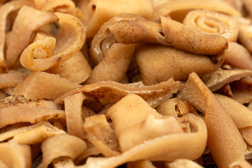Smoked pork rind - soric afumat, Romanian traditional food at winter Christmas market