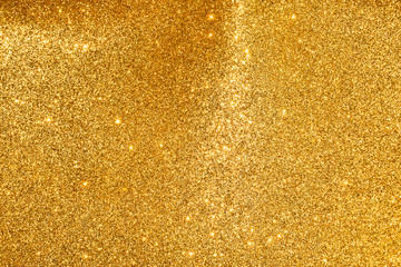 sparkles of golden glitter abstract background	