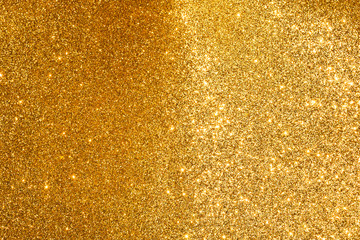 sparkles of golden glitter abstract background	