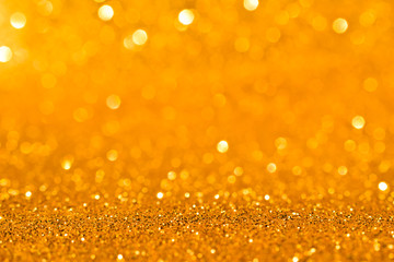 sparkles of golden glitter abstract background	