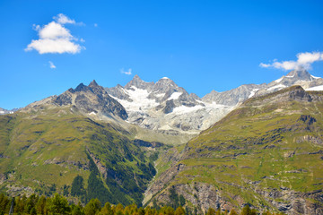 Fototapeta na wymiar Wide view of the Swiss Alps near the Matterhorn, seen along the 5-Seenweg Trail, Zermatt, Switzerland