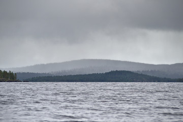Obraz na płótnie Canvas Beautiful lakeside view in Lake Inari in Lapland, Finland
