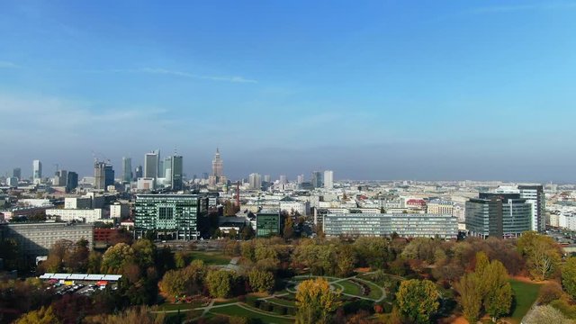 enormous Cityscape with large road and high-risers in Warsaw City center near urban green area, aerial, modern city skyline, stock exchange buildings